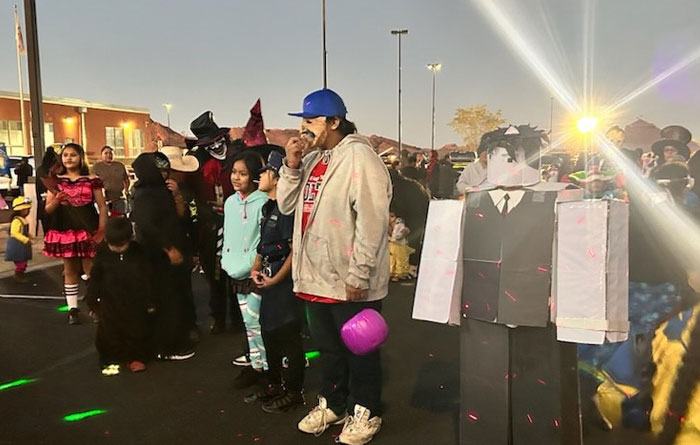Parents and students dressed up for Halloween. 